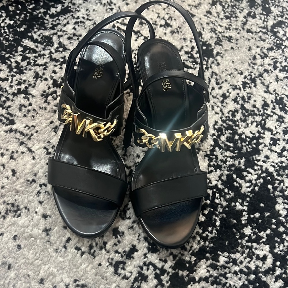 Micheal Kors black heel with gold embellishment logo